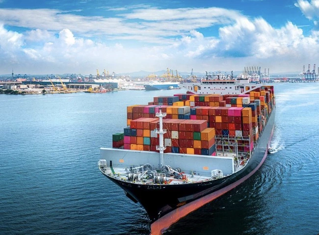 Container vessel carrying international cargo — user-selected reference photograph